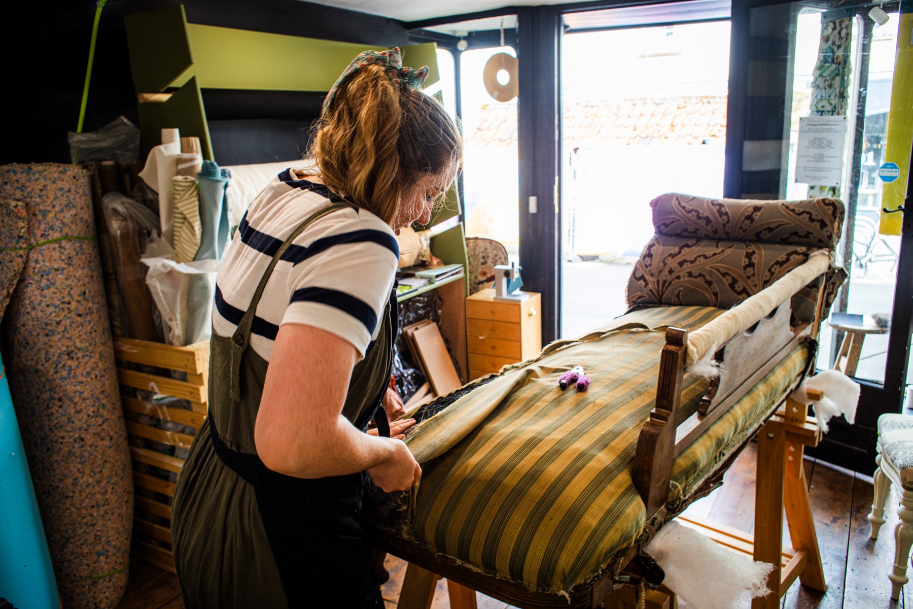 Nicolle Wilson working on an upholstered chaise at 10 Market Place.